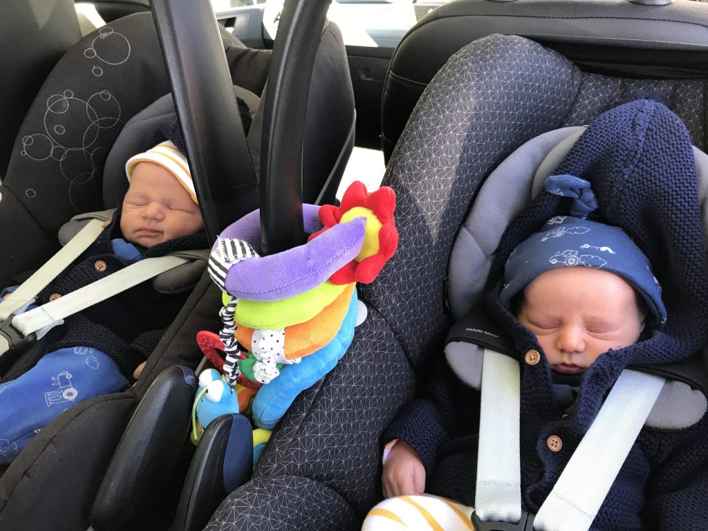 When you no longer have to carry twins in portable car seats, it's a baby milestone