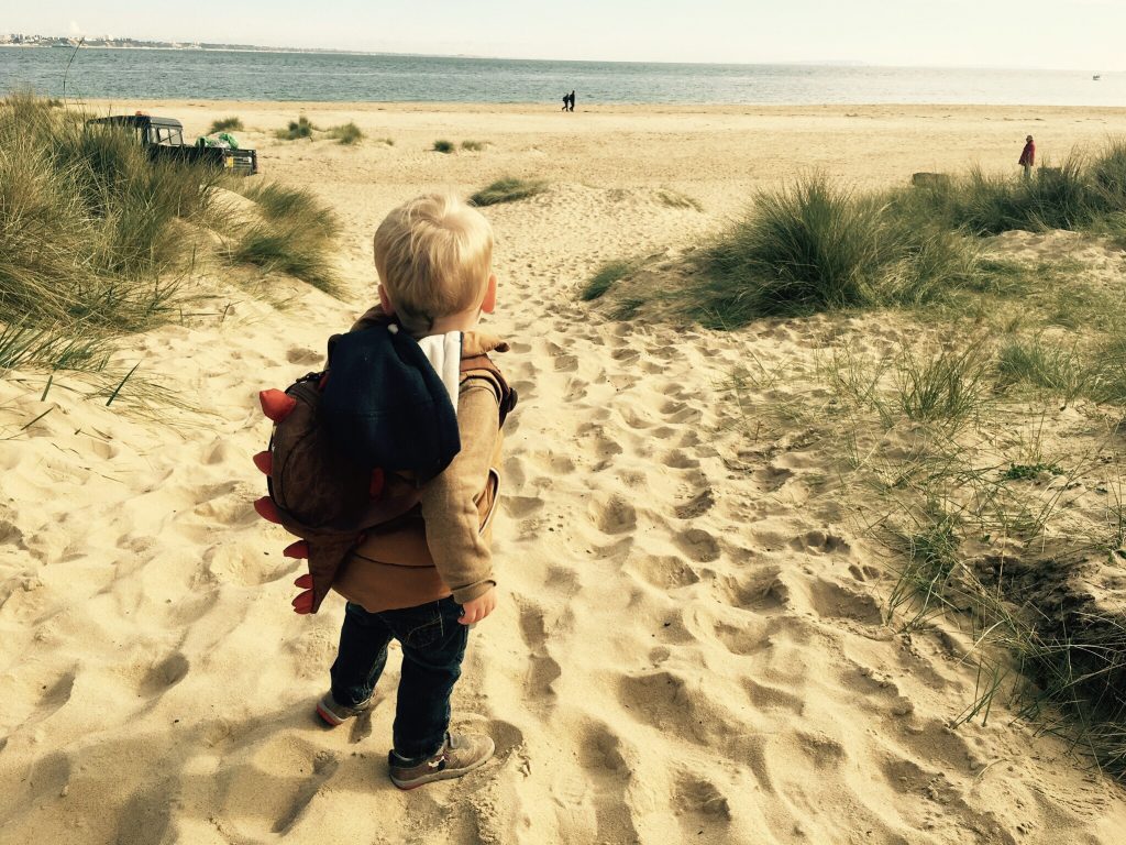 A toddler on Studland beach in Dorset