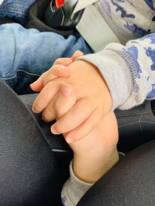 twins and toddler holding hands asleep