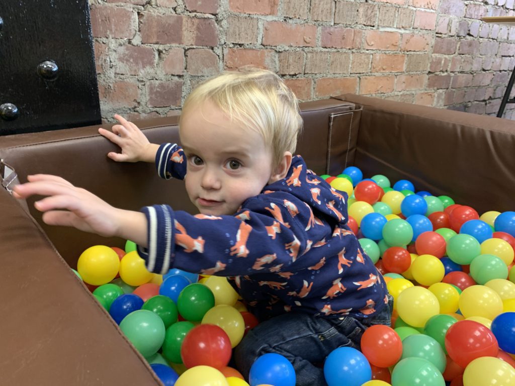 Toddler in a ball pool