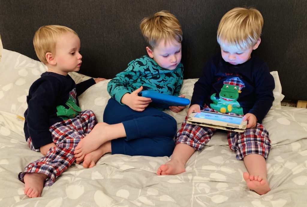 Twins and three year old watching Cbeebies before bed