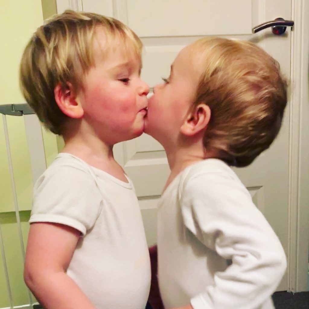 Twins share a kiss