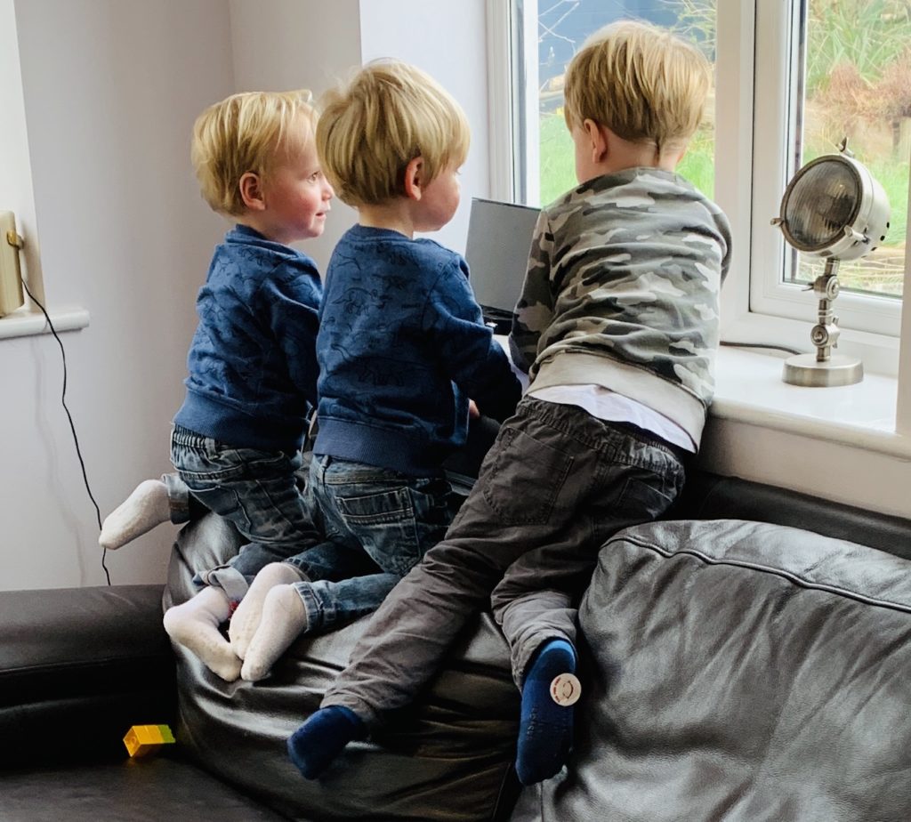 Three boys chatting on the top of the settee for the #ItsOK bloggers linky