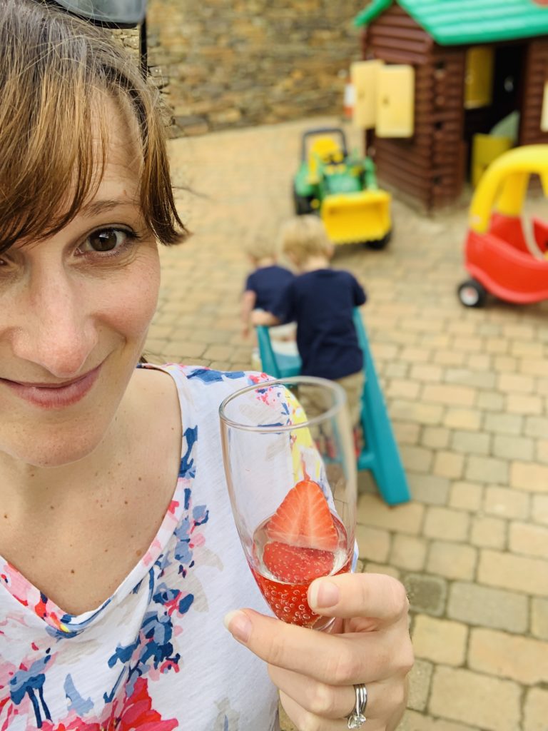 Mummy drinking prosecco in the play area at Glynn Barton