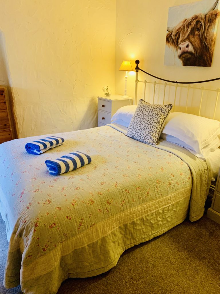 Bedroom of the Old Stables cottage at Glynn Barton