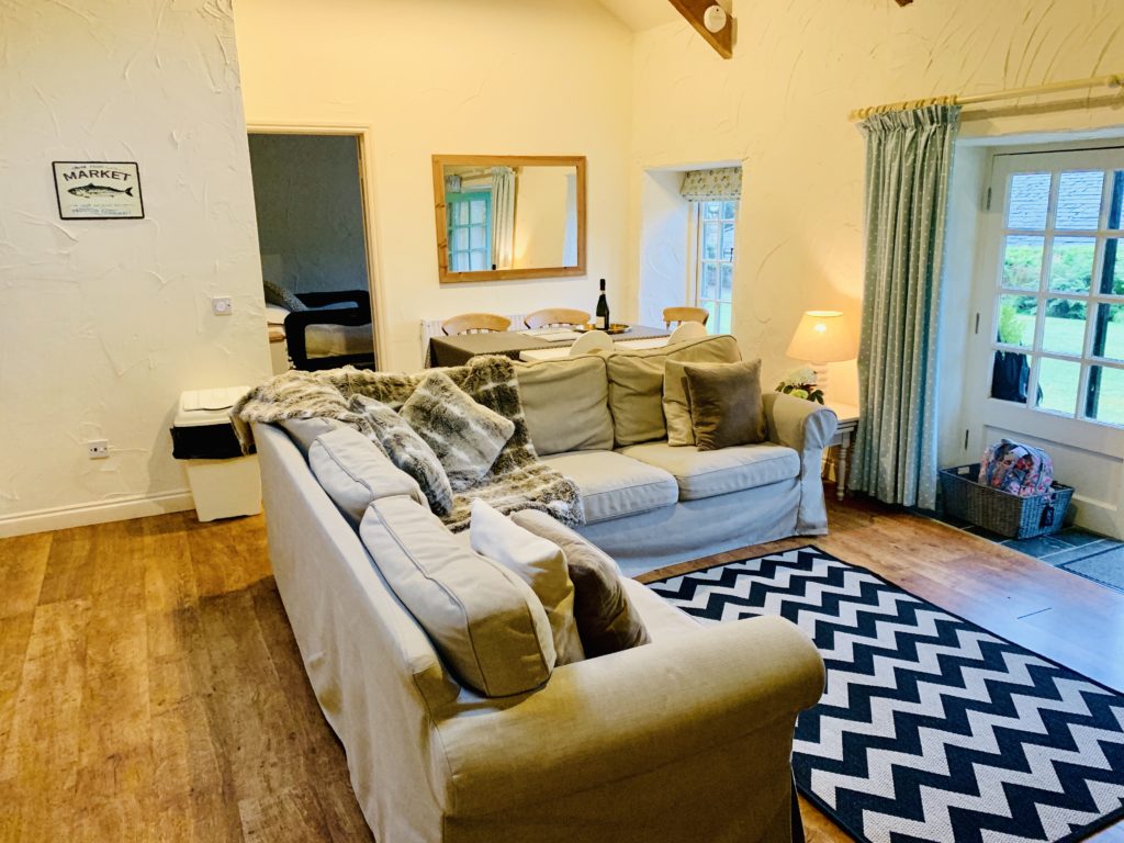 Lounge area of the Old Stables cottage at Glyn Barton