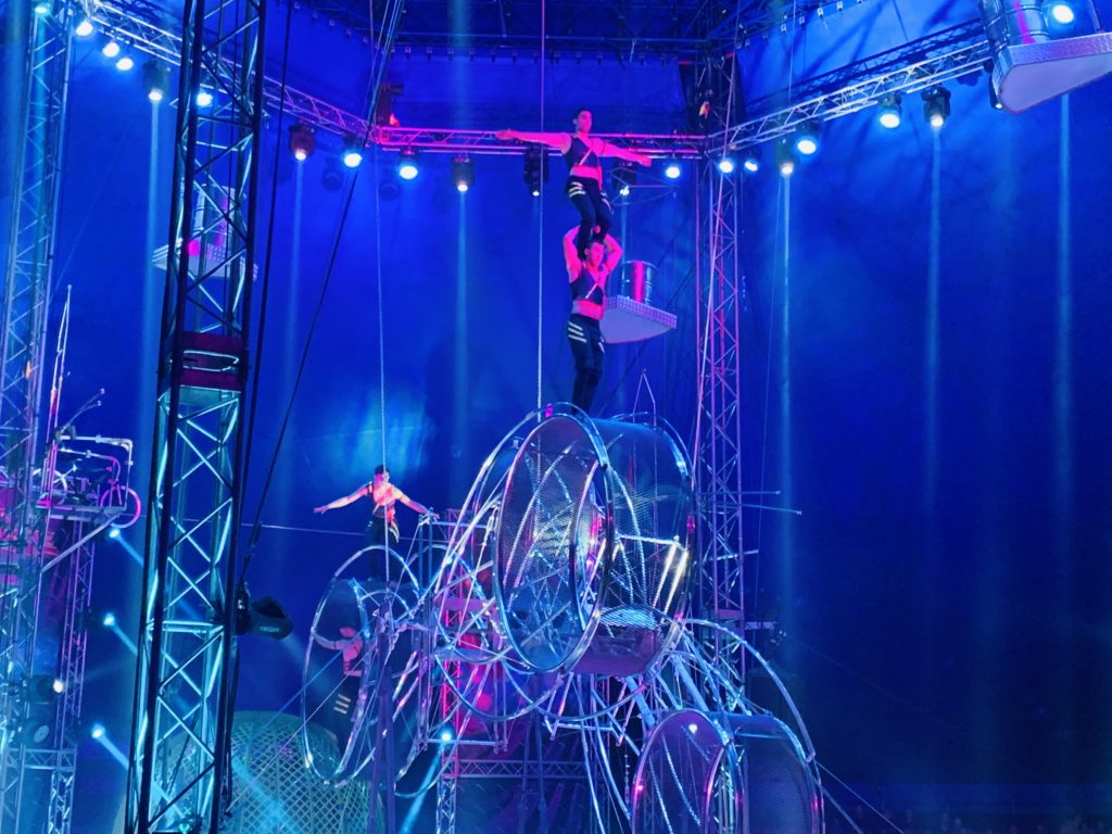 Circus Extreme performers performing on spinning wheels