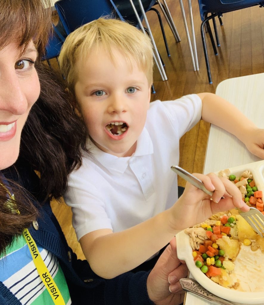 Mum and son enjoying a school dinner