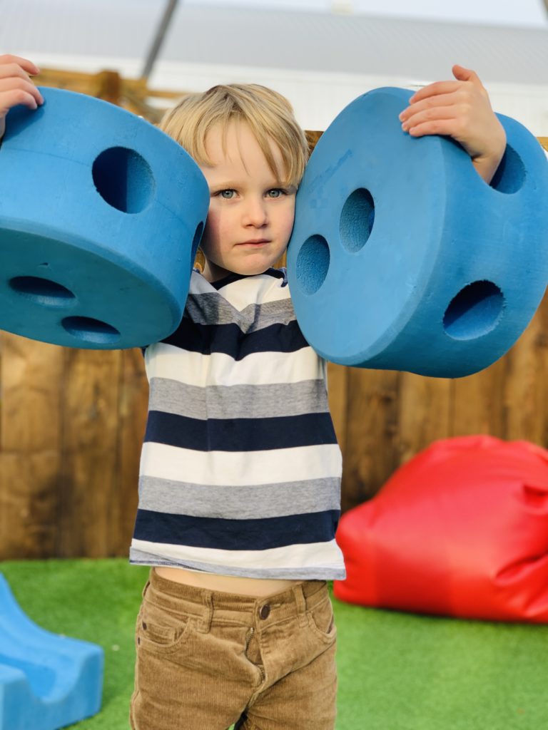 Boy plays with foam blocks at Bluestone's Serendome