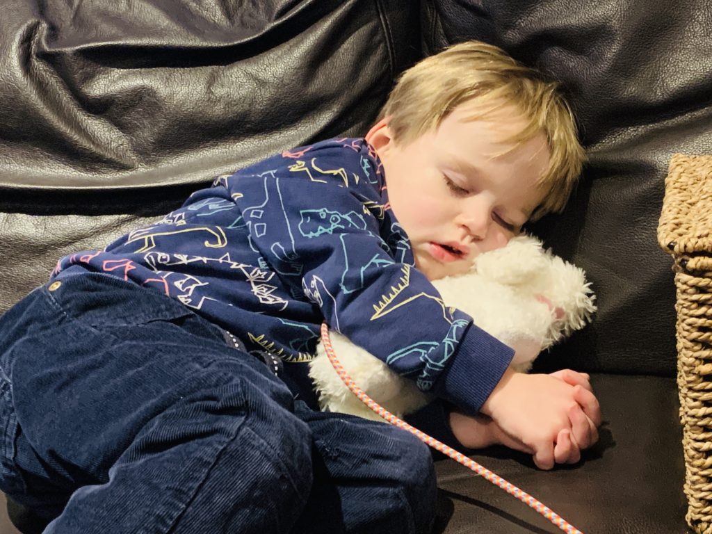 Toddler napping on the settee