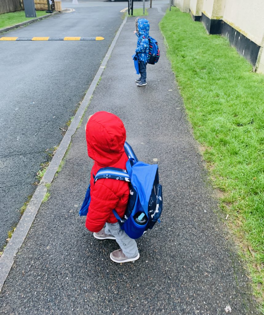 twins walking to preschool