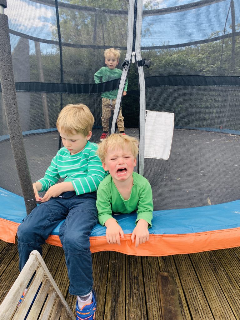 Brothers cry on the trampoline before being sent back to school