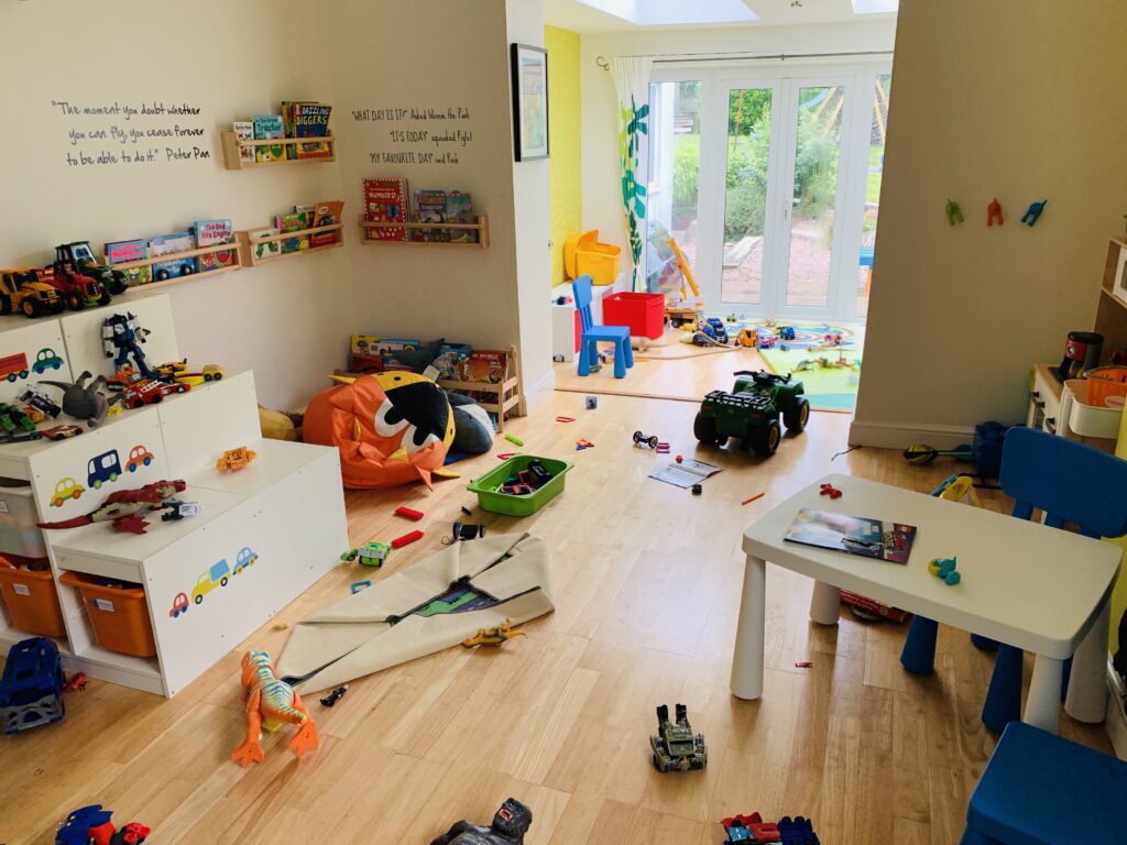 A playroom messy with toys