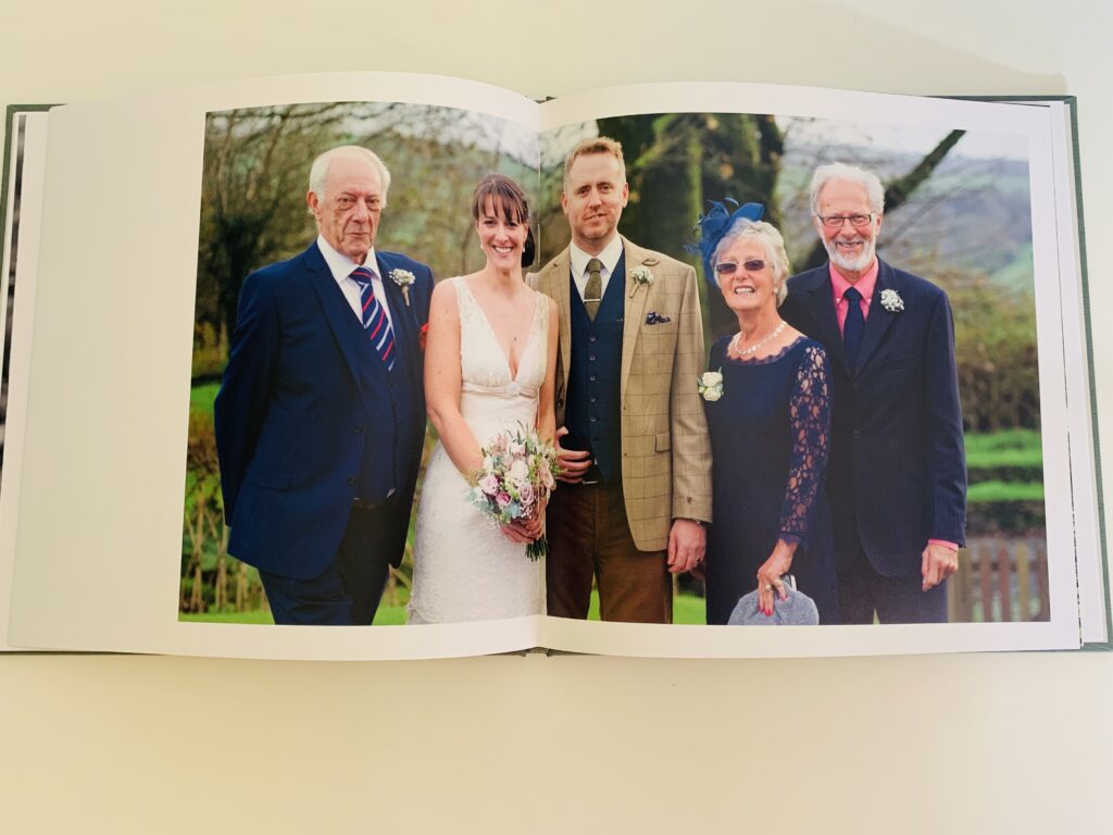 Wedding couple and parents in a Rosemood photo book