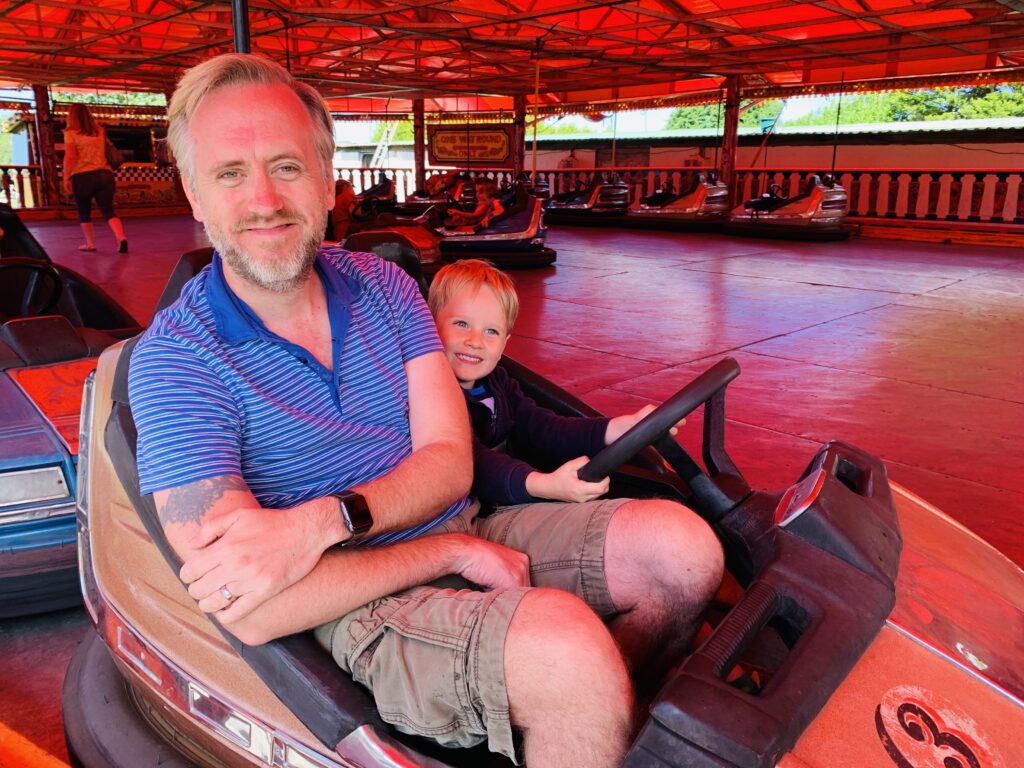 Dad and son on the dodgems