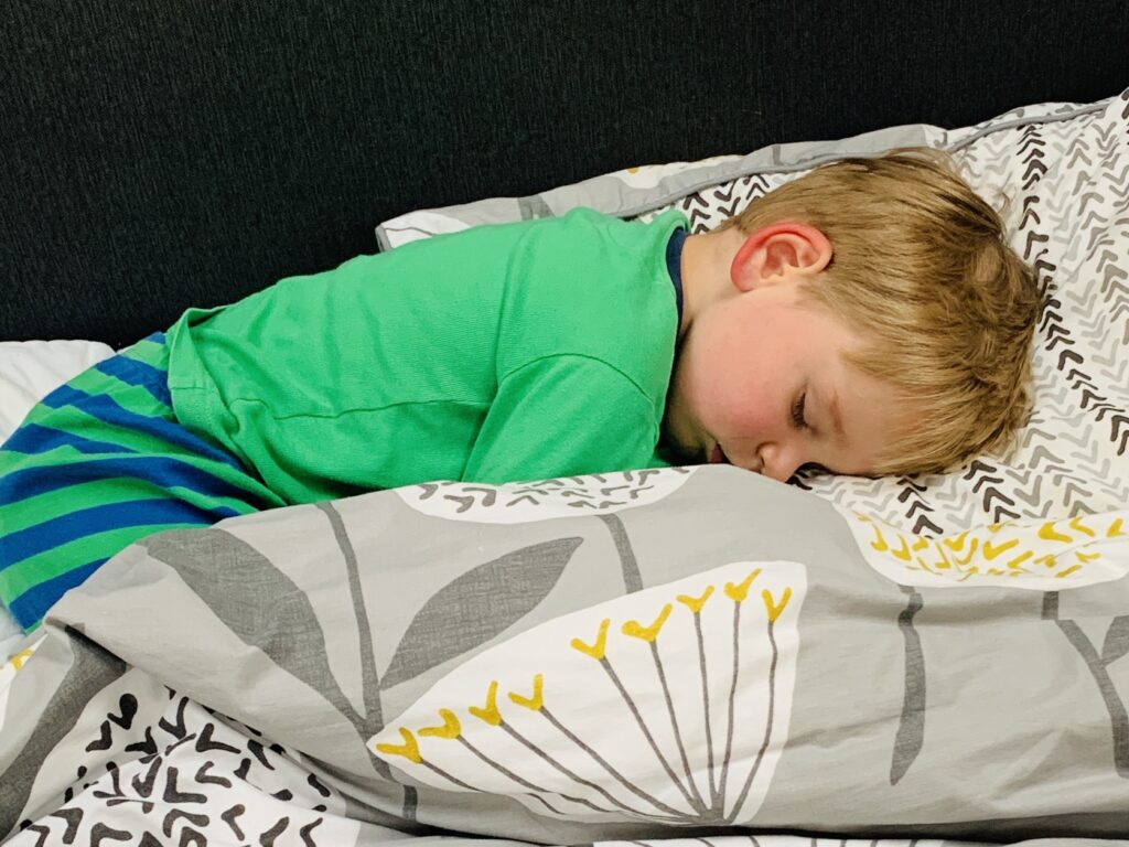 Three year old asleep in parents' bed for a sponsored post with TEMPUR®