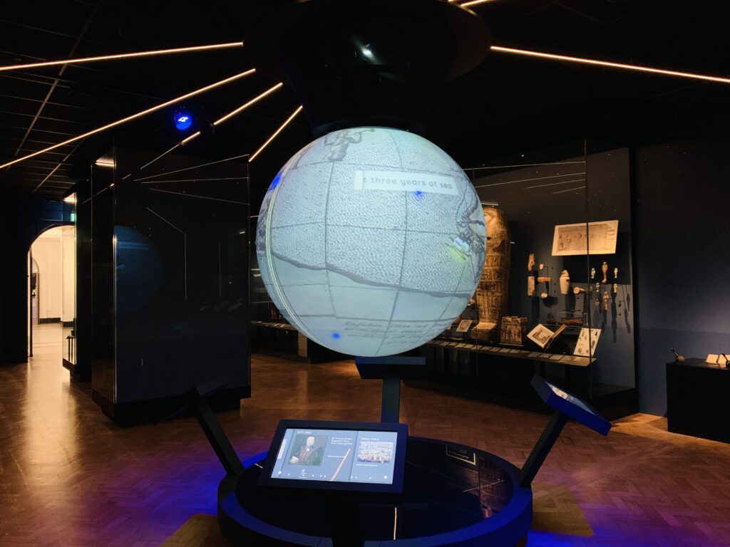 A digital spinning globe showing journeys taken from Plymouth at The Box museum