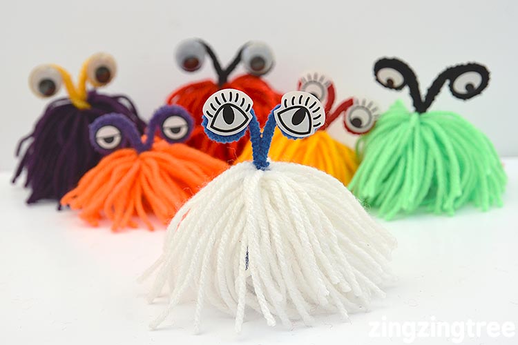 Colourful yarn monsters made out of pipe cleaners and yarn is one of many easy craft ideas