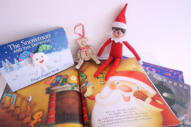 Elf on the Shelf ideas in a pile of books