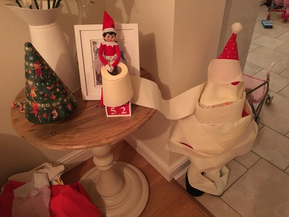 Elf on the Shelf ideas - wrapping Santa in toilet paper