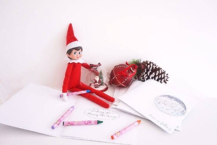 Elf toy writing Christmas cards