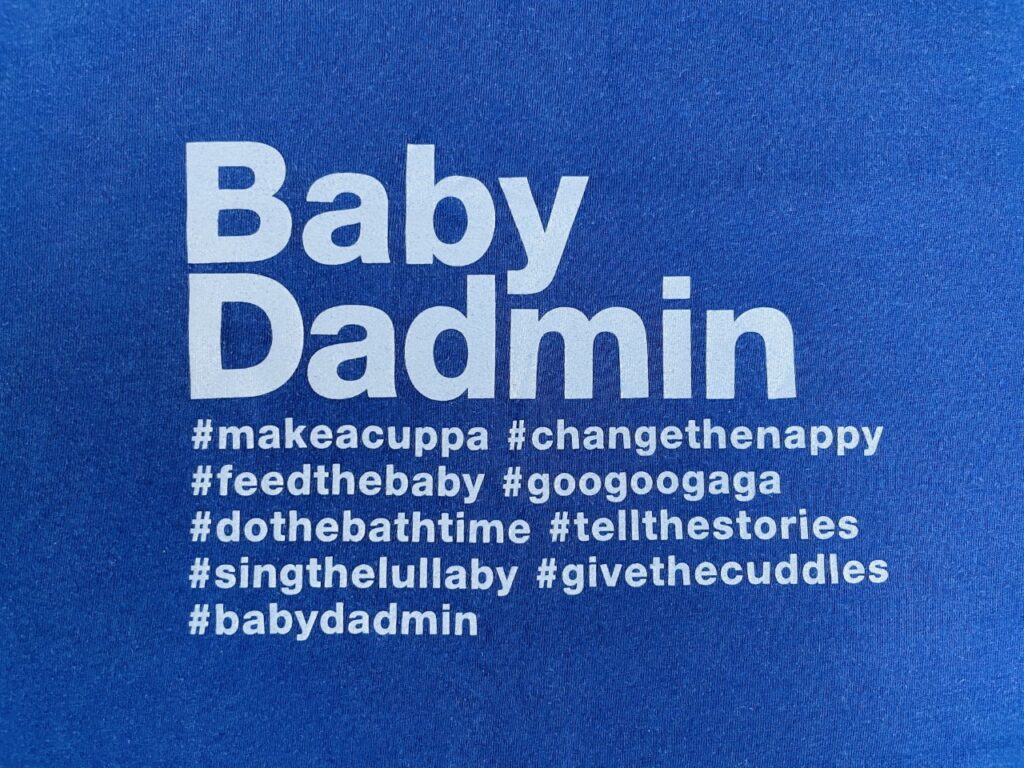 White 'Baby dadmin' slogan on a navy blue t-shirt