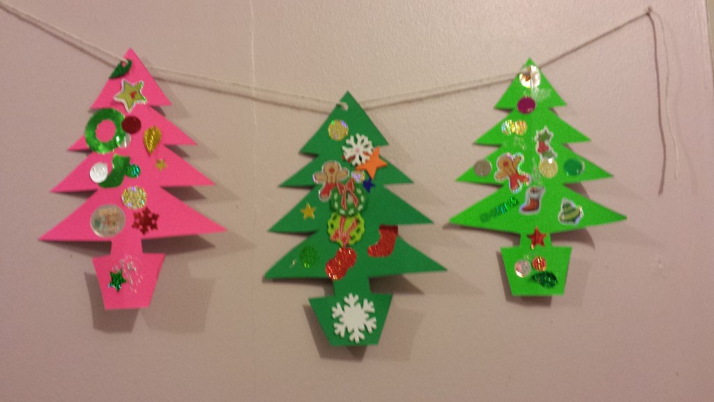 Christmas tree bunting made out of green card and stickers and strung together