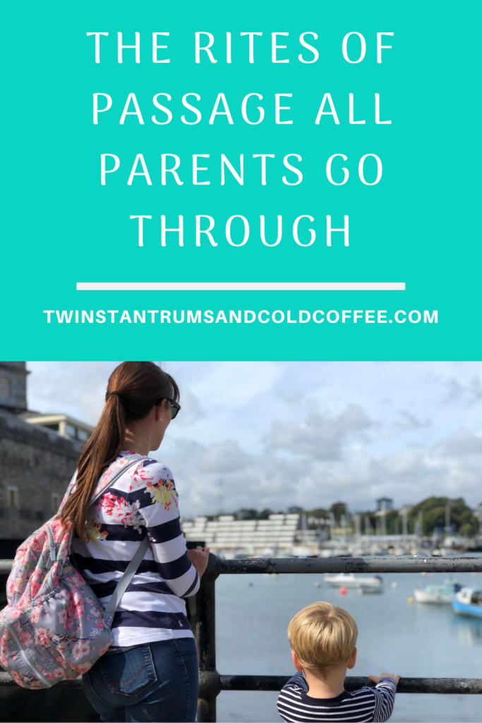 Mum with long dark ponytail and four year old boy leaning on fence looking at boats