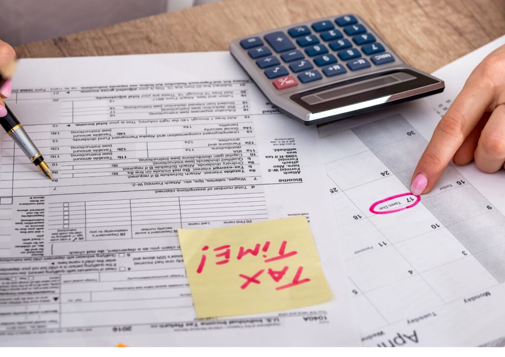 Paperwork and calculator ready for filing your taxes