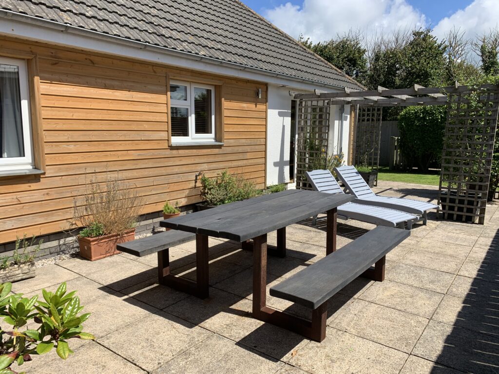 Sun loungers on a patio at a holiday home in north cornwall