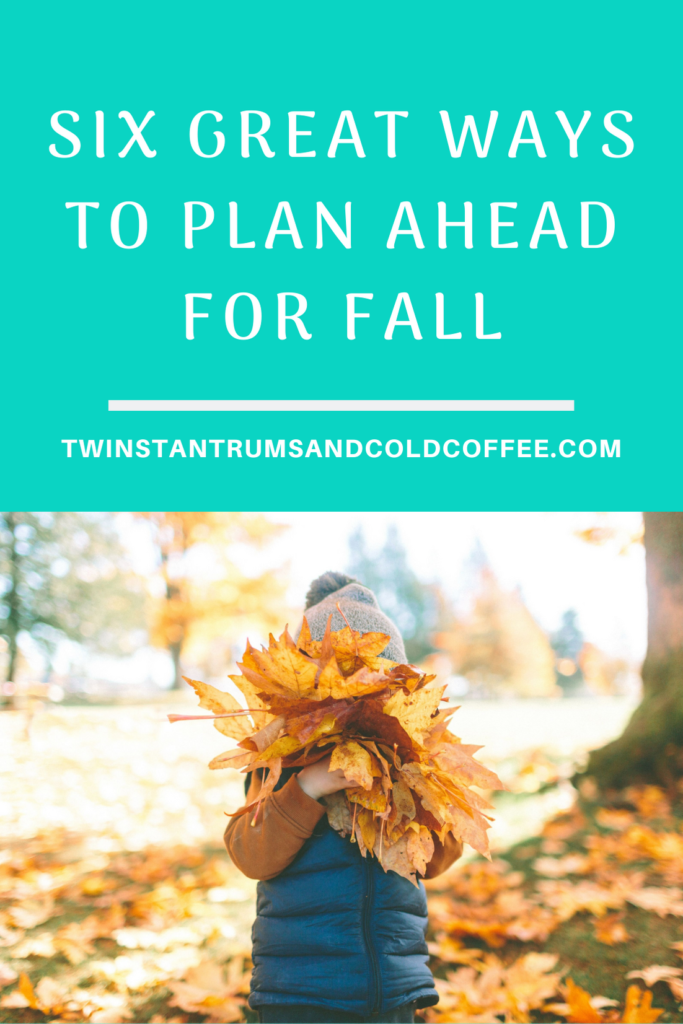 how to plan ahead for fall, with a boy hiding behind a bunch of golden leaves