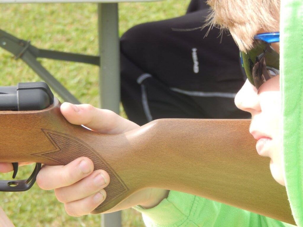 A boy holds a gun at a holiday club 