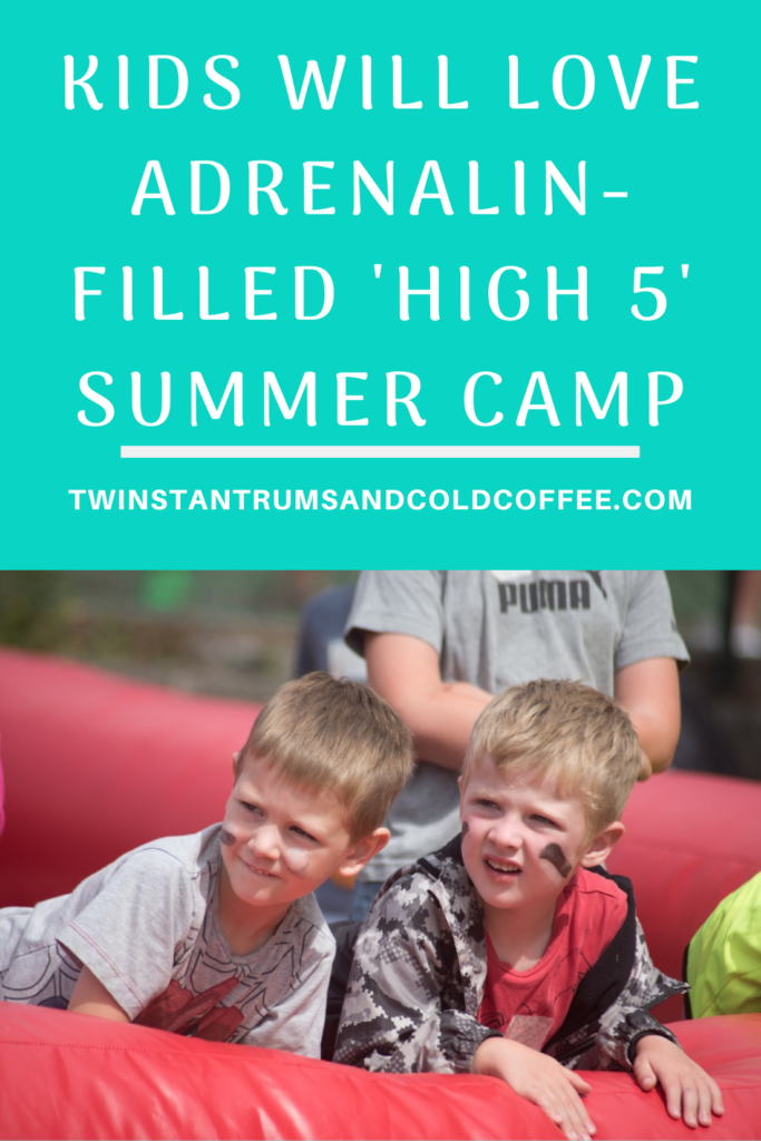 PIN image for high 5 summer camp with a pic of two brothers leaning on the side of a red inflatable