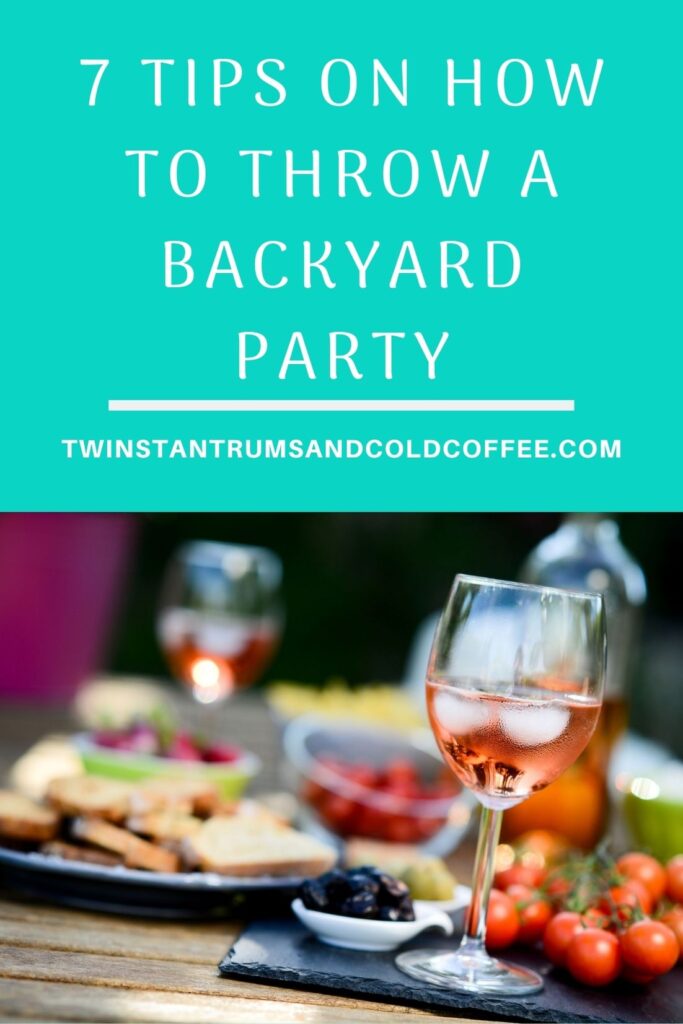 food and drink on a table for a pin about how to throw a backyard paraty