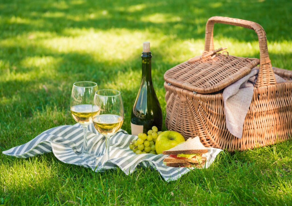 A picnic basket with wine to celebrate a wedding anniversary