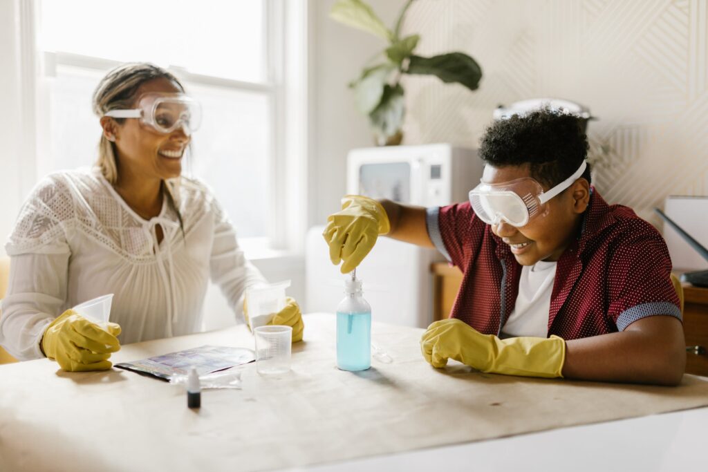 A mum and son doing a science experiment at home