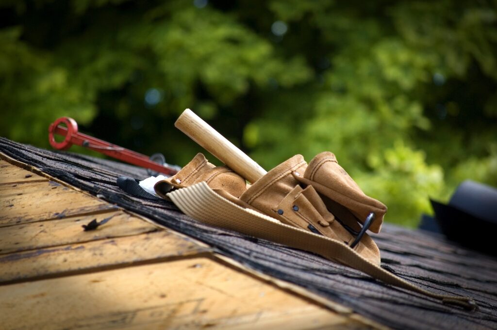 A toolbelt left on a roof by a roofing contractor doing a roof renovation project