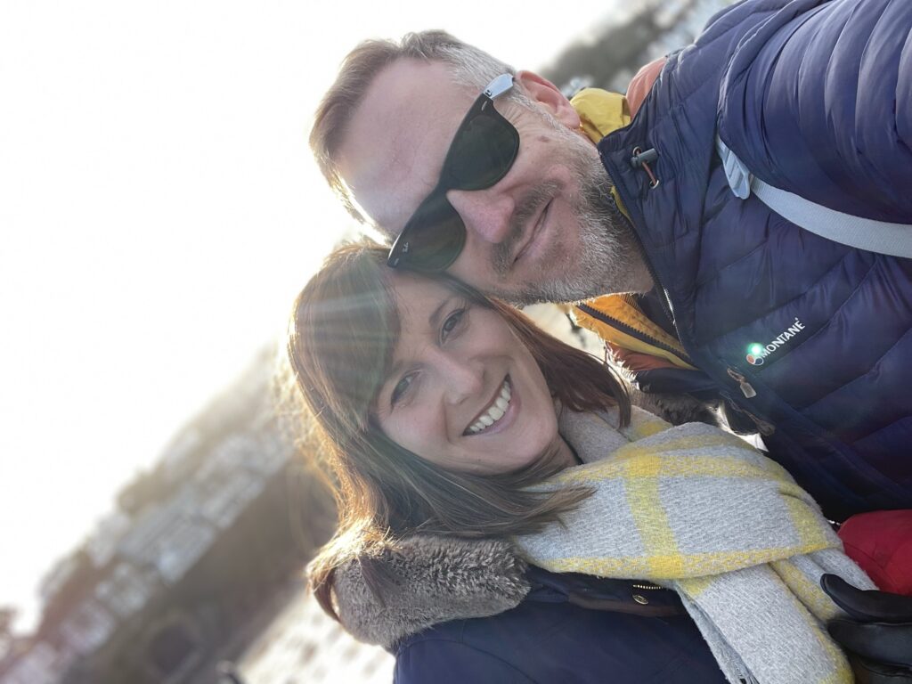 Couple take a selfie on the beach at Looe