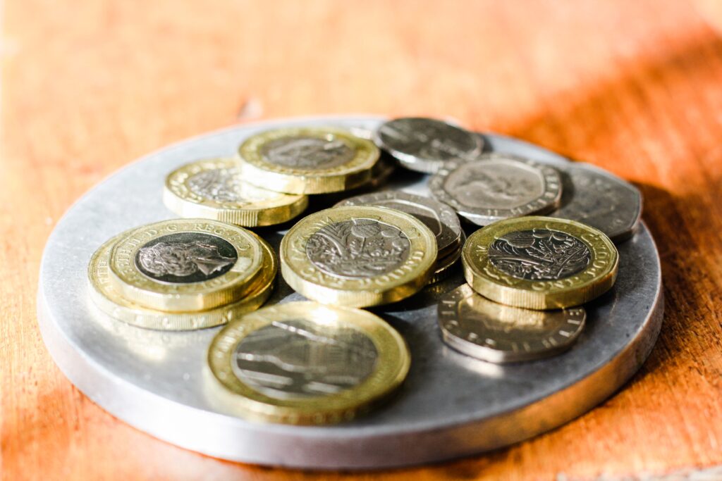 Plate of coins for a post about budgeting tips and money lessons