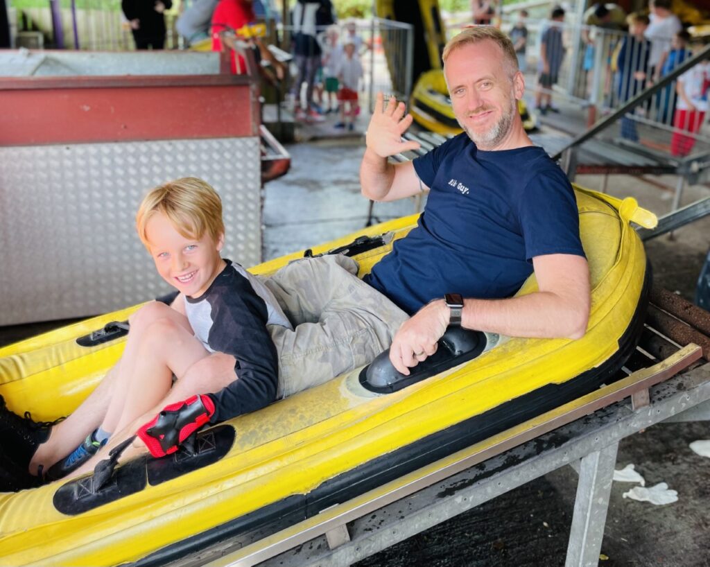 Dad and son on the waterslide at Woodlands theme park