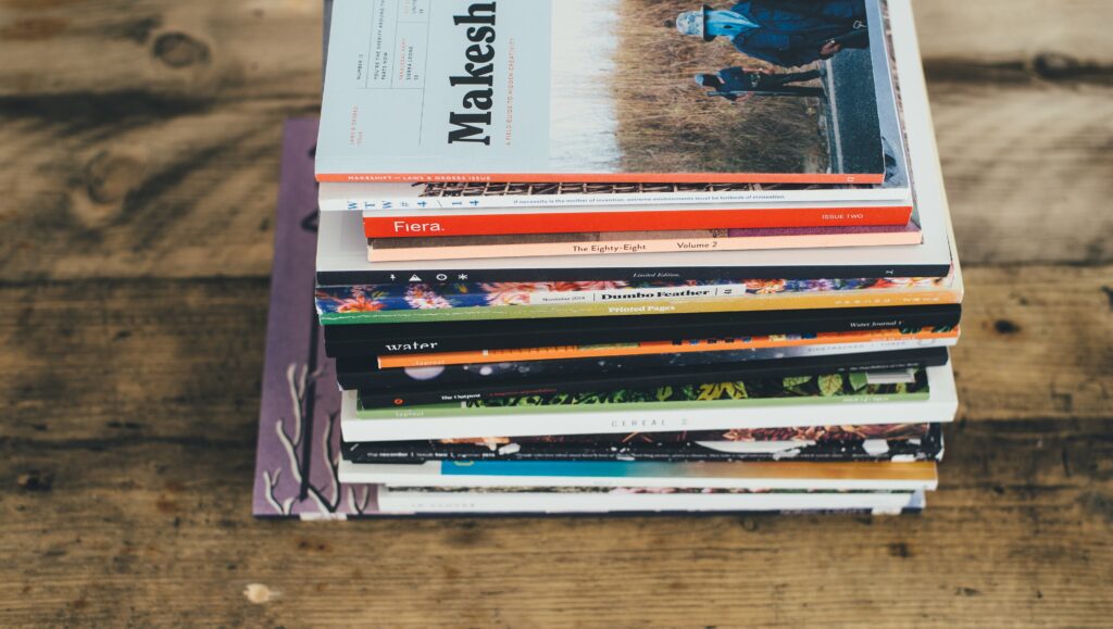 A pile of magazines on a table. A subscription is a great father's day gifts idea