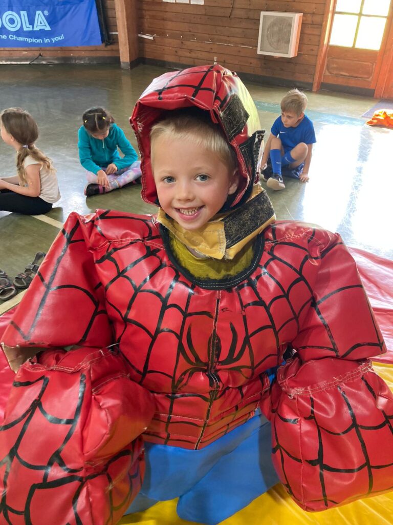 Boy in a sumo suit at High 5 summer camps