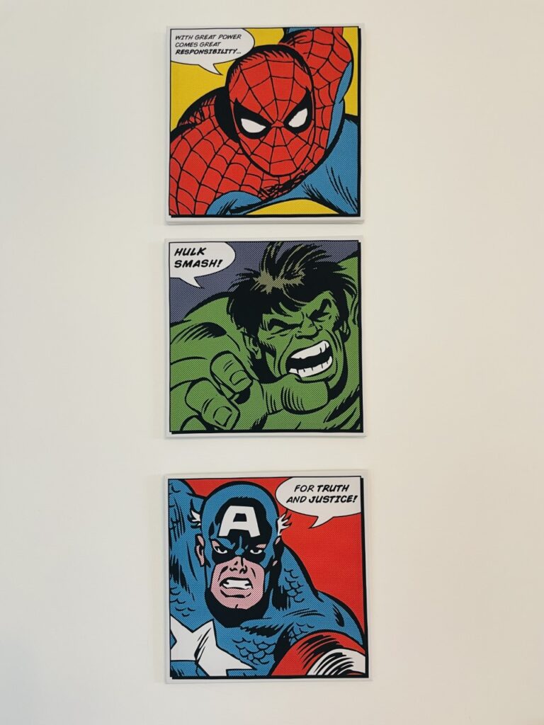 Superhero canvases on the wall for how to make your kids' playroom fun