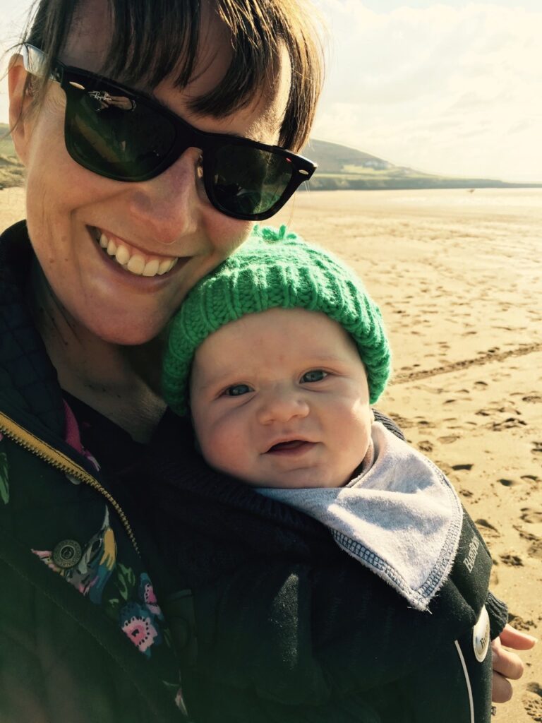 A mum and baby at Croyde Bay in North Devon