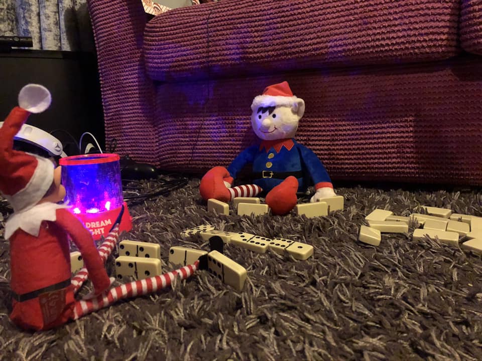 Elf on the shelf playing dominos by Amber Hesabi Randall