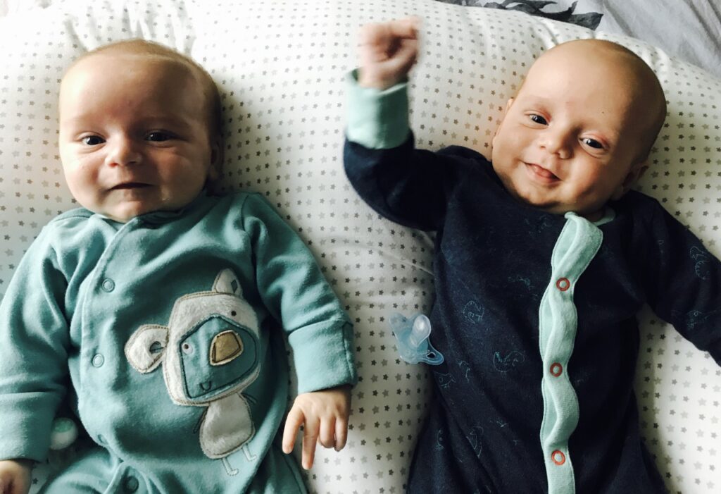 Twins on a twin feeding pillow which is one of the best gifts for twin mums you can get 