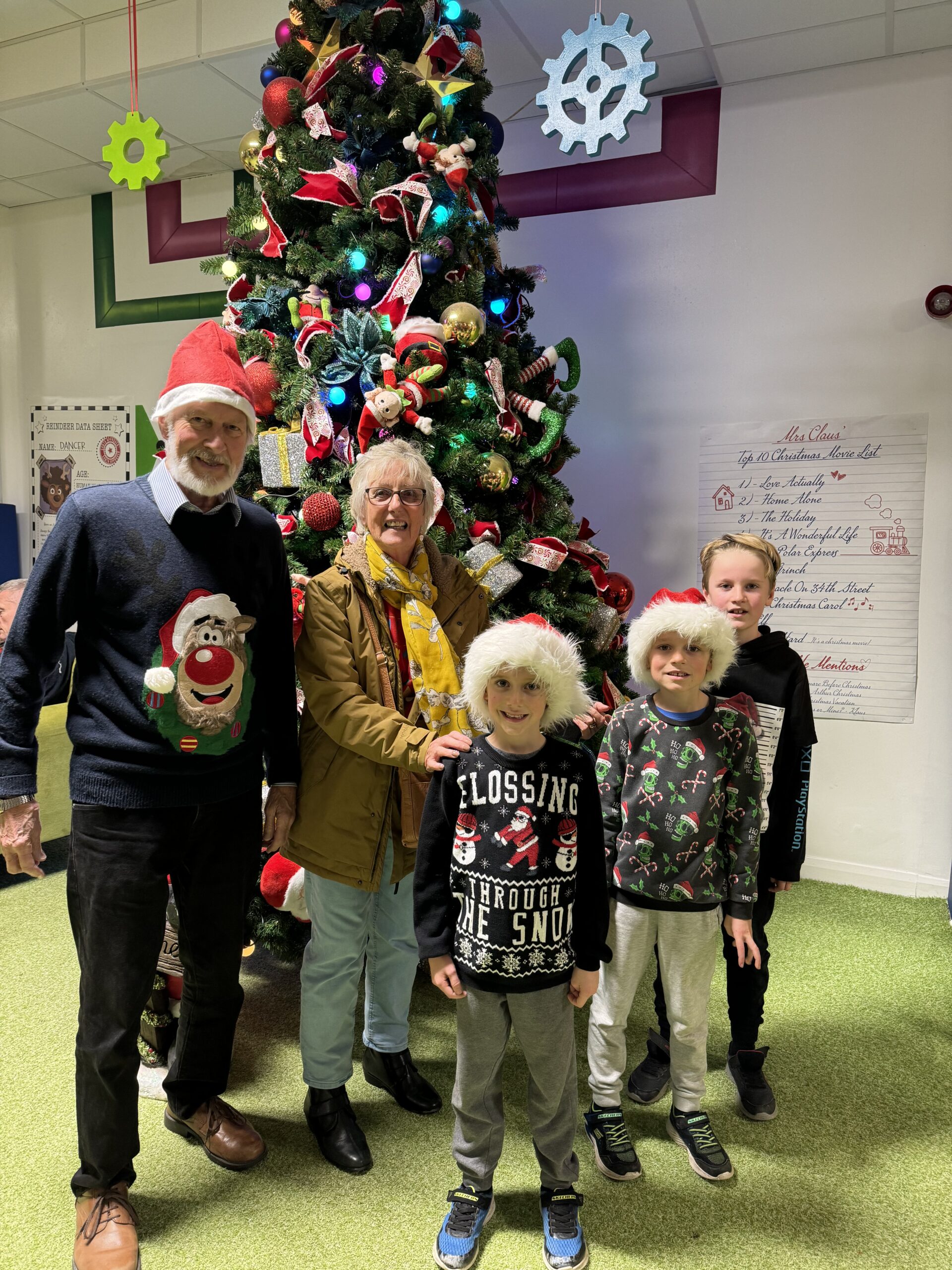 A family by the Christmas tree at Bluestone