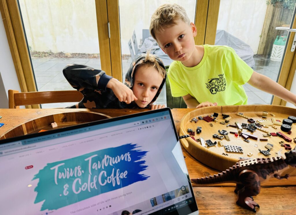 Twin brothers build old lego during a rainy school holiday