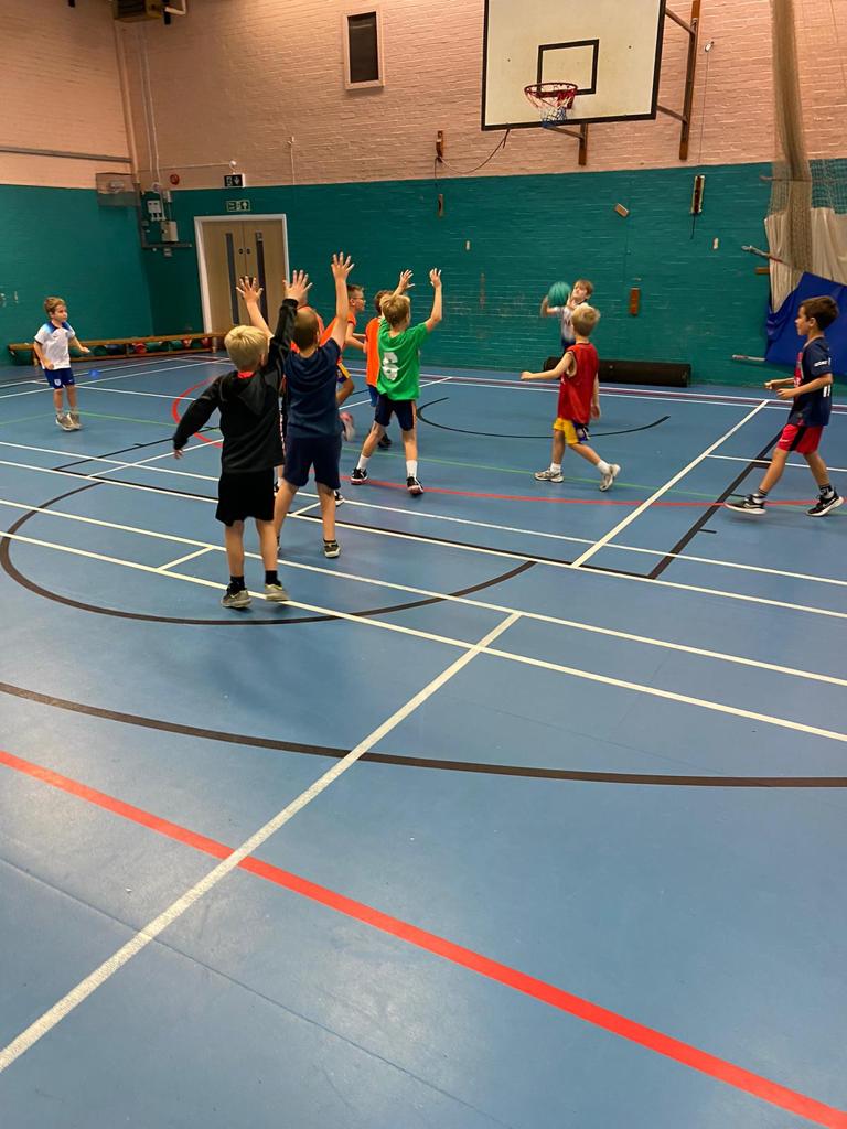 Kids take part in a basketball camp during Easter 2024 in Plymouth