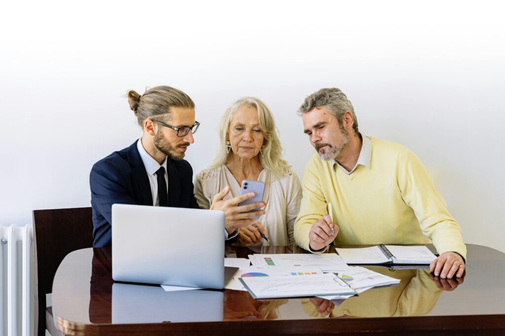 An older couple talk about their financial future with an advisor